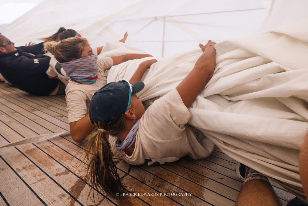 Crew aboard the schooner Adix at work on deck